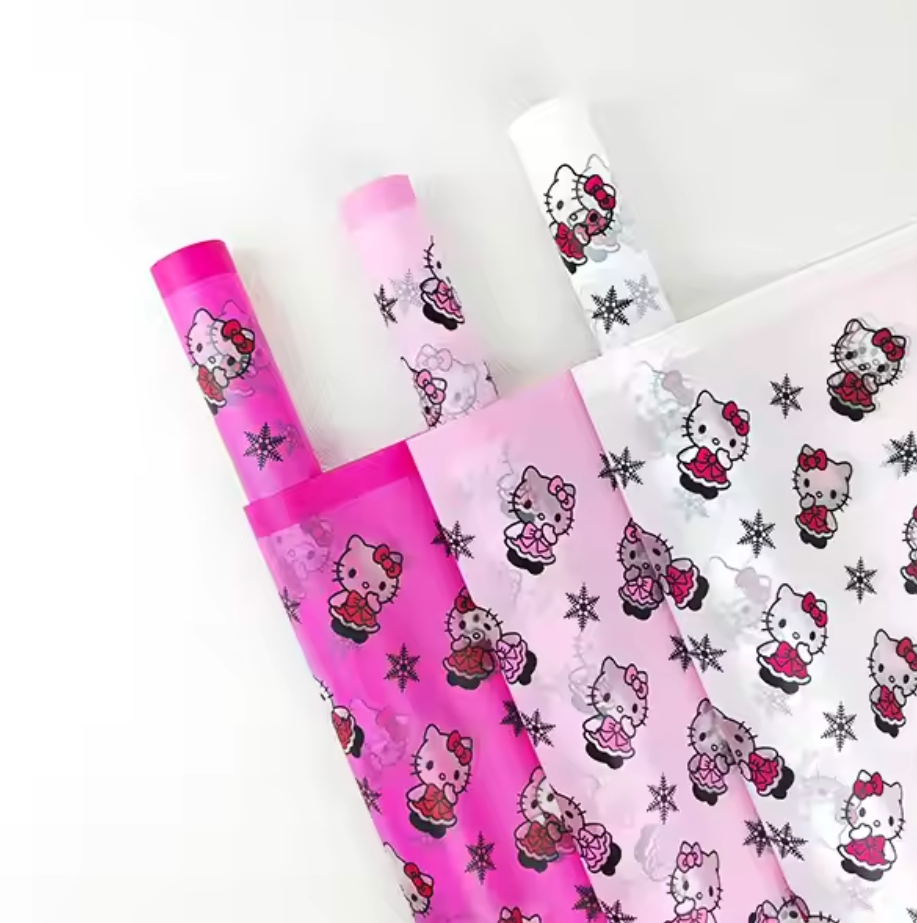 Papel de regalo floral con copos de nieve de Hello Kitty